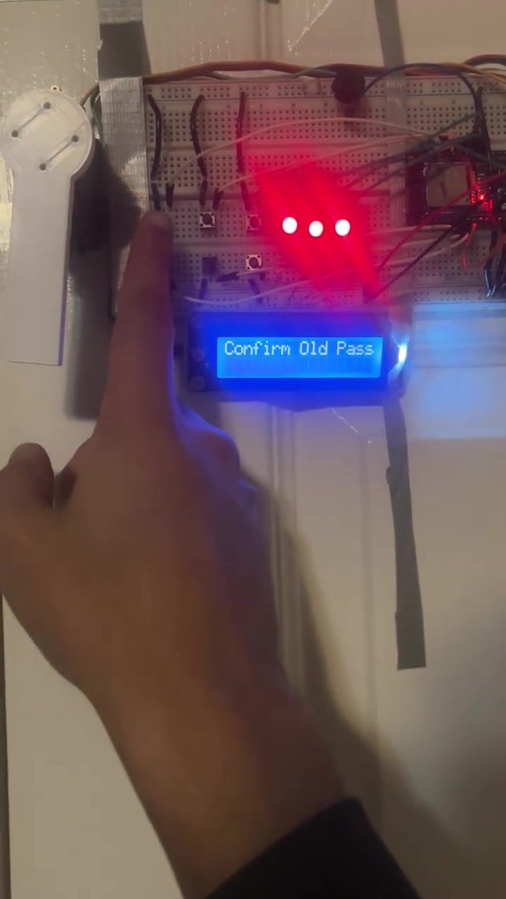 The LCD reading Confirm Old Pass during a PIN change, three LEDs lit.